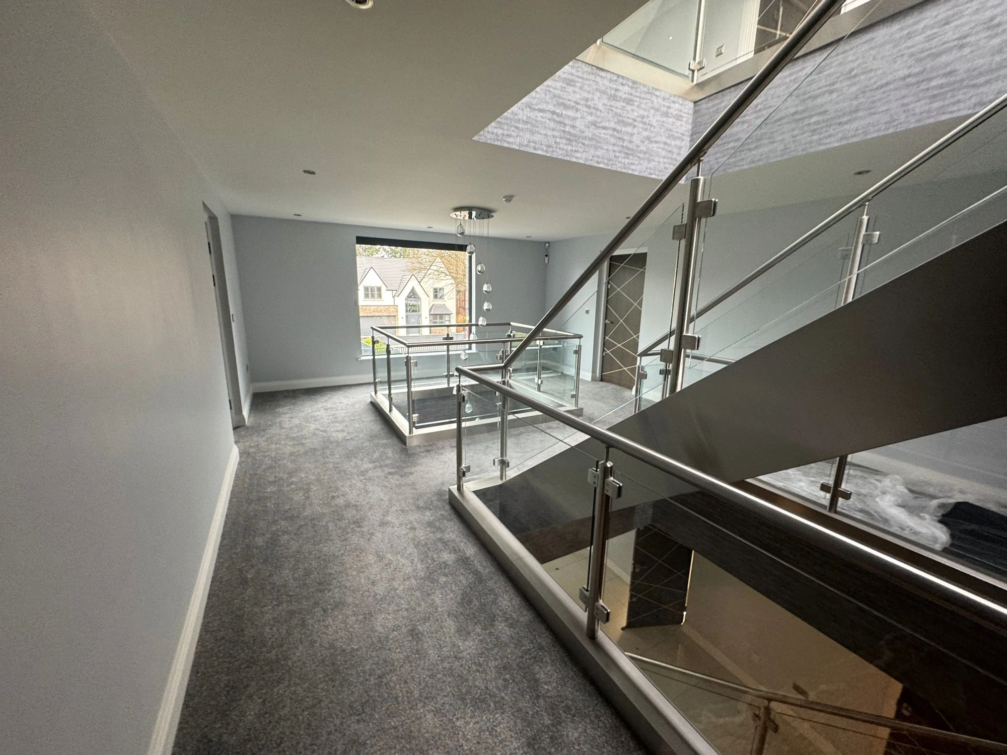 Refurbished hallway and staircase by Preece Refurbishments